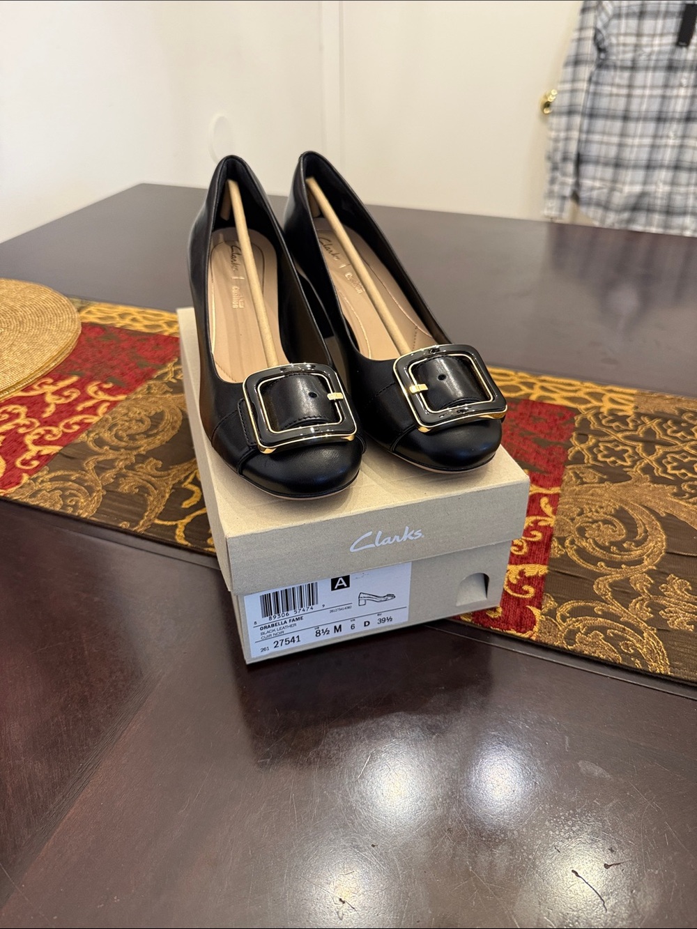Clarks Black Leather Flats with Gold Buckle Accent
